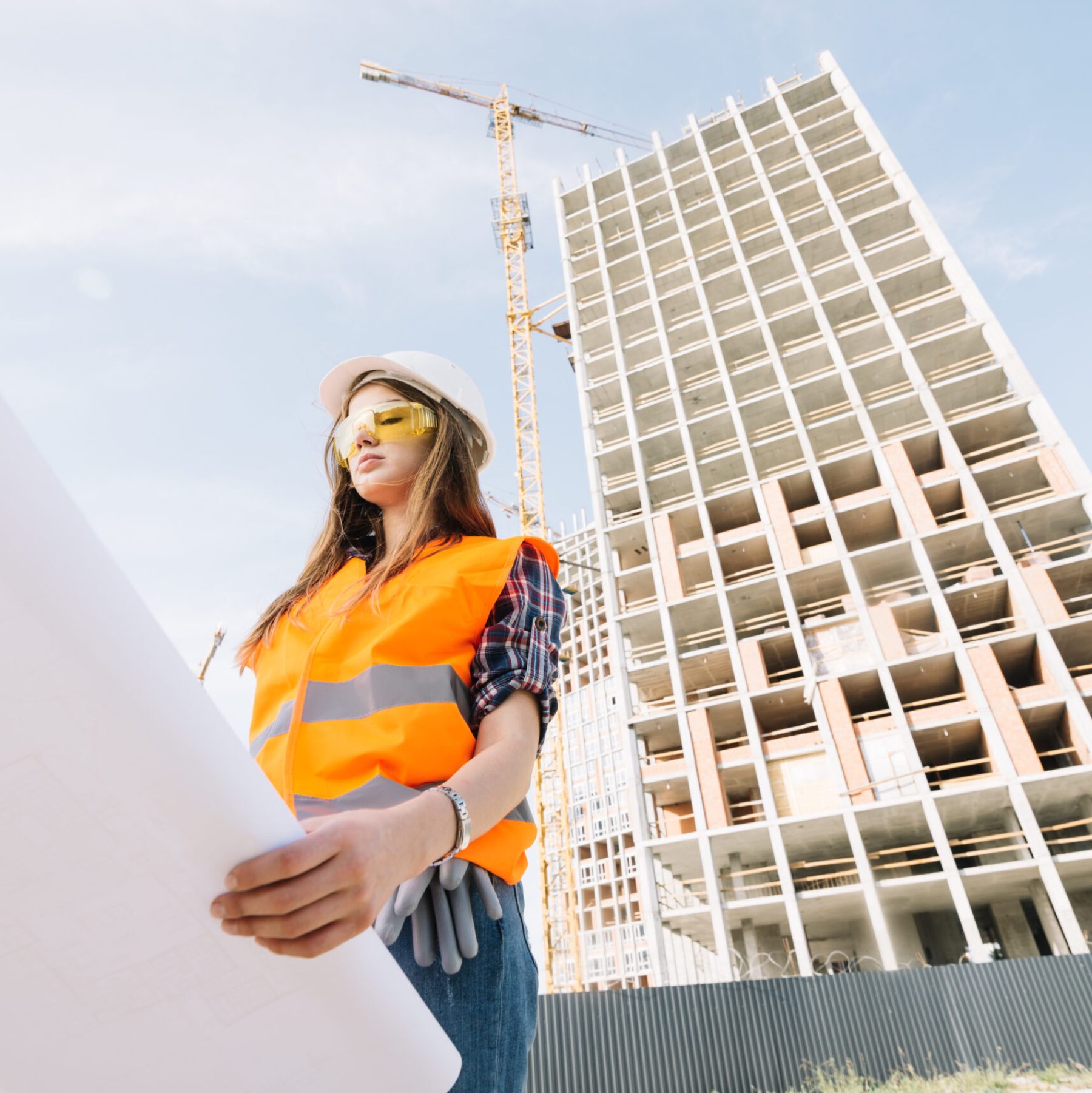 woman-studying-draft-construction-site